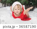 girl in santa costume on snow 36587190
