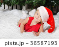 smiling little girl in santa costume on snow 36587193