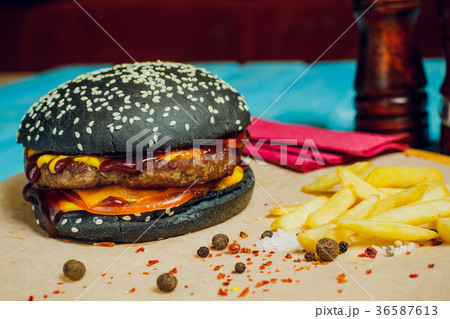 burger with meat cutlet, on turquoise table. burger with meat cutlet, on turquoise table. 36587613