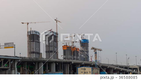 Many of cranes. Tower cranes against blue sky Many of cranes. Tower cranes against blue sky 36588085