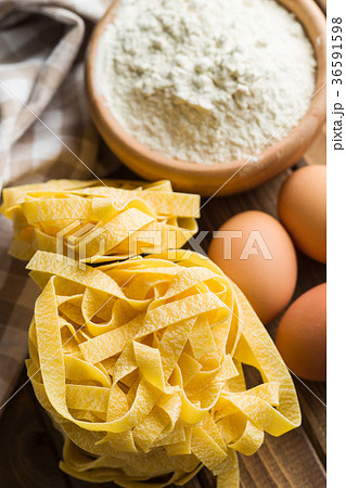 Raw tagliatelle pasta. 36591598