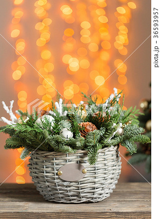 Beautiful Christmas composition in a wicker basket Beautiful Christmas composition in a wicker basket 36593957