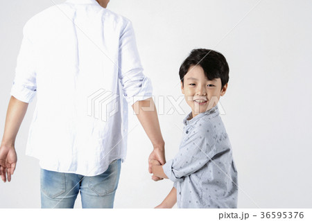 Young father and son playing together portrait. Studio shot. 034 Young father and son playing together portrait. Studio shot. 034 36595376