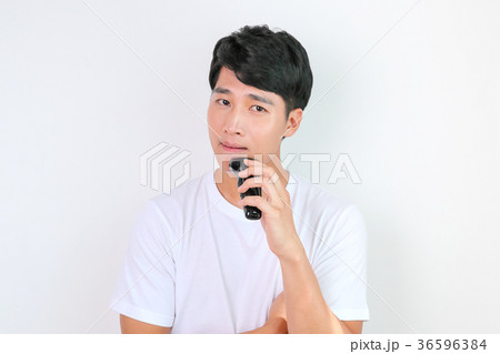 A mugshot of Young guy.- shaving, put lotion, hair dryer, etc. 245 36596384