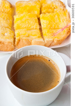 Breakfast with coffee and bread on the table 36600591