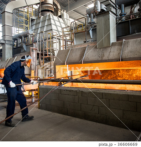 Hot steel pouring in steel plant 36606669