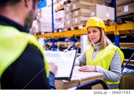 Young warehouse workers working together. 36607593