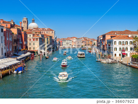 Colorful channel with boats sailing in city Colorful channel with boats sailing in city 36607922