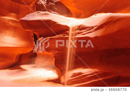 Sand Flowing off the Red Rocks of Antelope Canyon 36608770