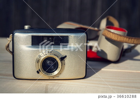 Old vintage golden Penti I camera on wood 36610288
