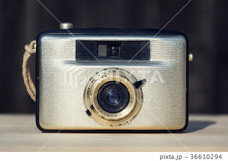 Old vintage golden Penti I camera on wood 36610294