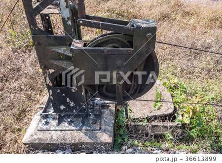 Old steel pulley with the metal wire. Old steel pulley with the metal wire. 36613899