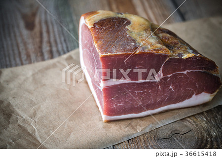 Prosciutto on the wooden board 36615418