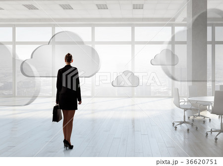 Businesswoman in top floor office Businesswoman in top floor office 36620751