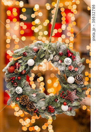 Beautiful Christmas wreath in woman hands Beautiful Christmas wreath in woman hands 36632786