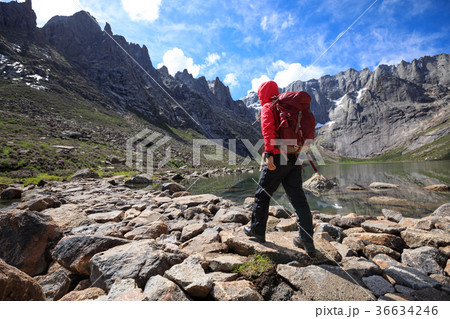 woman hiker hiking at high altitude mountains woman hiker hiking at high altitude mountains 36634246
