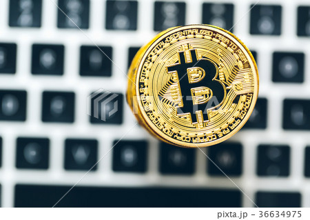 Stack of bitcoins with a laptop Stack of bitcoins with a laptop 36634975