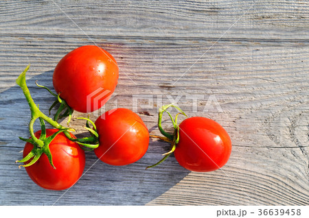 Red tomatoes on wooden surface. Flat lay,top view. Red tomatoes on wooden surface. Flat lay,top view. 36639458