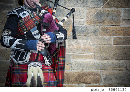 Playing the bagpipes on streets of Edinburgh 36641132