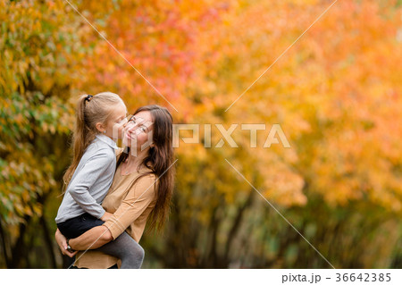 Family of mother and little kid outdoors in park 36642385