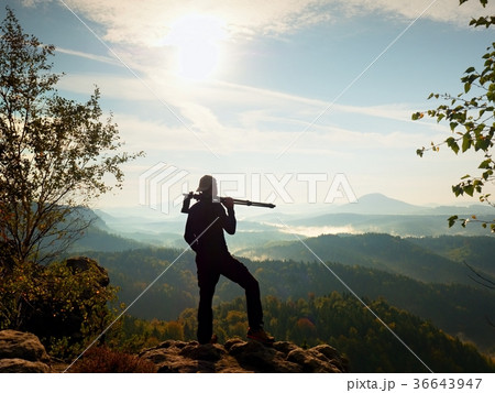 Nature photographer stay at tripod on summit 36643947