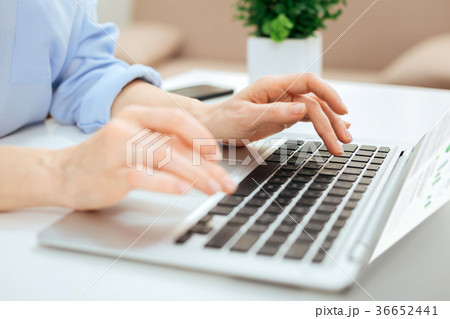 Woman typing on the keyboard and working on the Woman typing on the keyboard and working on the 36652441