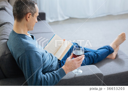 Calm man reading his book Calm man reading his book 36653203