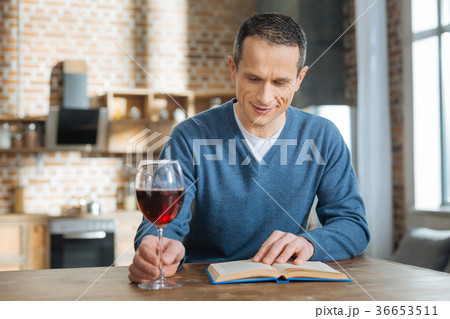 Positive delighted brunette reading favorite book Positive delighted brunette reading favorite book 36653511