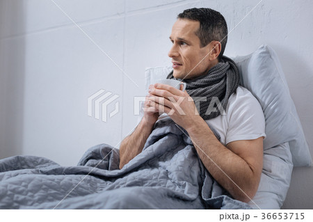 Sick man holding cup with hot tea Sick man holding cup with hot tea 36653715