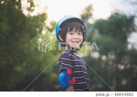Portrait of happy Boy in blue helmet standing 36654902