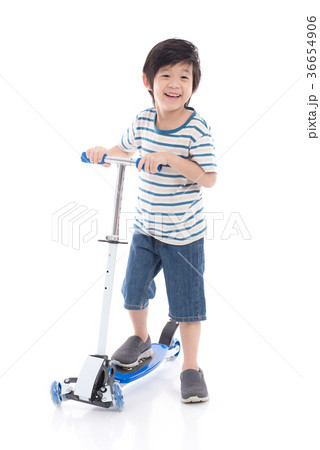 Asian boy riding a scooter on white background 36654906