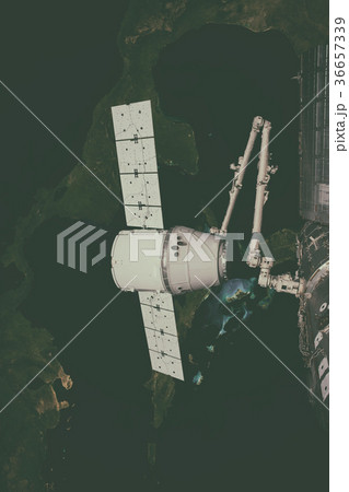 SpaceX Dragon orbiting the planet Earth. 36657339