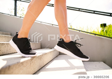 Unrecognizable athlete running down the stairs. 36660206