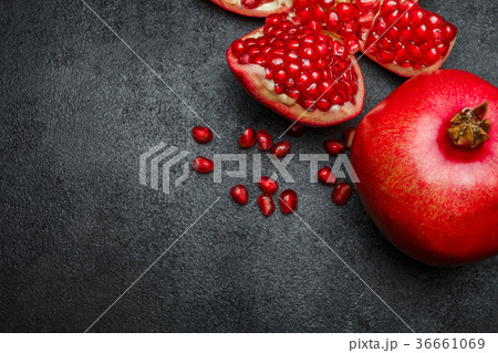 Pomegranate and seeds close-up 36661069