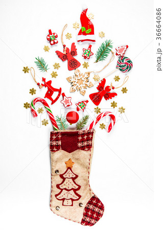 Christmas background with a sock from which  36664086