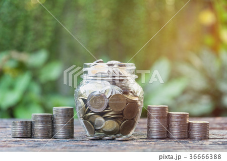 Coins in jar with money stack step growing money 36666388