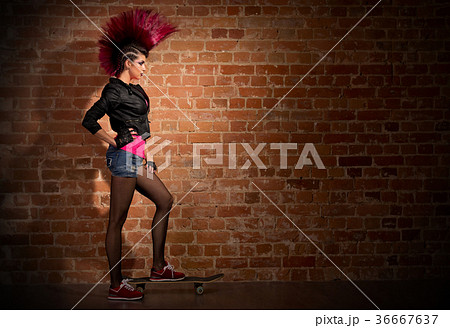 Punk girl on brick wall background Punk girl on brick wall background 36667637