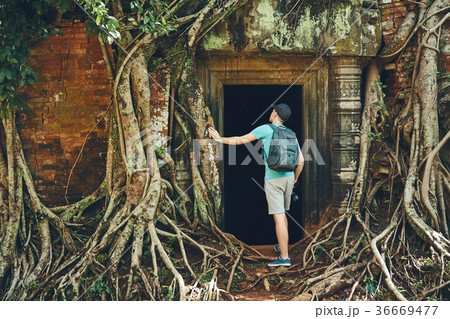 Traveler in the ancient temple 36669477
