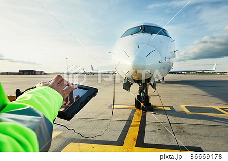 Preparations of passenger airplane at the airport 36669478
