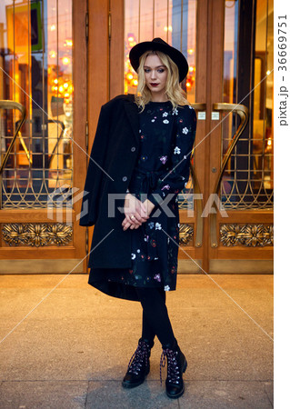 portrait of a girl in black clothes and a hat on 36669751