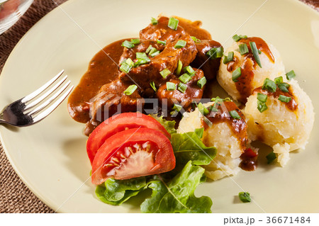 Goulash with boiled potatoes Goulash with boiled potatoes 36671484