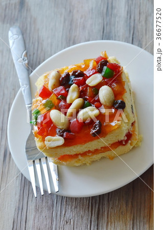 orange butter cake topping peanut and dried fruit  36677520