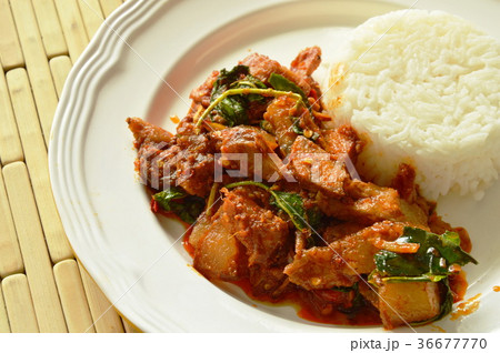 spicy stir fried grilled pork curry with herb spicy stir fried grilled pork curry with herb 36677770