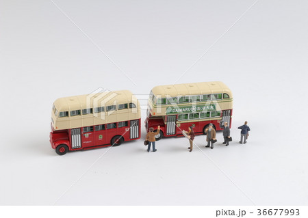 Min travellers at a bus station at board 36677993