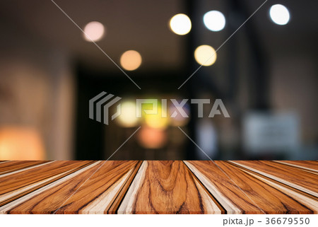Empty wooden table and blurred background of abstract in front o 36679550