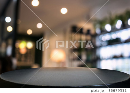 Empty wooden table and blurred background of abstract in front o 36679551