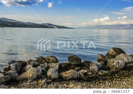 volcanic rocks and calm sea 36681337