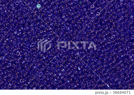 Transparent beads closeup. Blue beads. 36684071