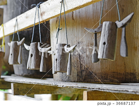old wooden cowbell hanging on the wall old wooden cowbell hanging on the wall 36687137