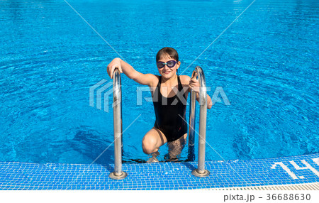 Cute teen girl in swimming pool Cute teen girl in swimming pool 36688630